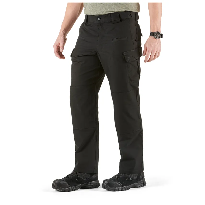 A person wearing a black colored stryke pant